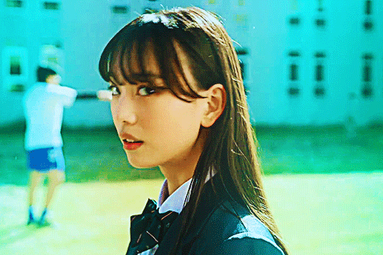 GIF of kudo rinne in kamen rider gotchard turning her head in apparent shock. the GIF is highly saturated with cyan tones on both sides of the canvas, except rinne's face