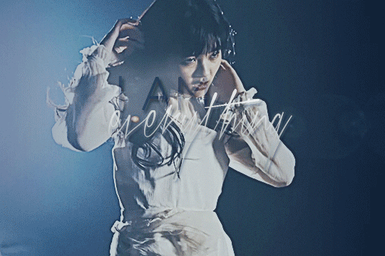 GIF of tamura meimi dancing erratically in her music video for mukei yuukei. the contrast is washed out but the vibrance is up. there's stylized text that says 'i am everything'