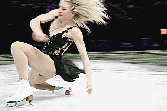 amber glenn laying back on her knees and turning over and gliding on the ice before getting back up at the gala
