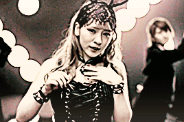 sugaya risako dancing and lip syncing with members behind her