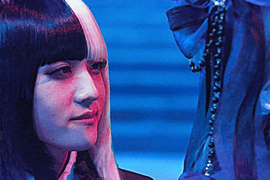 GIF of jeebh in kamen rider gavv looking at lizel across from him as he smiles wistfully