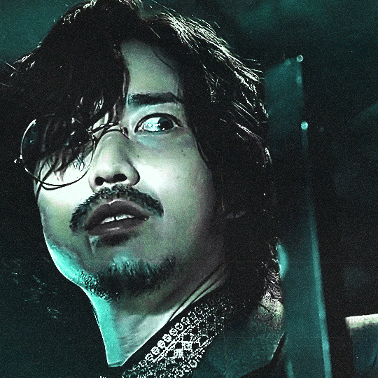 green/cyan tinted dark gif of glion from kamen rider gotchard