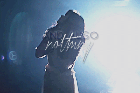 GIF of tamura meimi in the same video, also with stylized text but this time it says 'and also nothing'