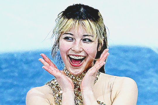 alysa liu smiling widely with her hands by her cheeks happily